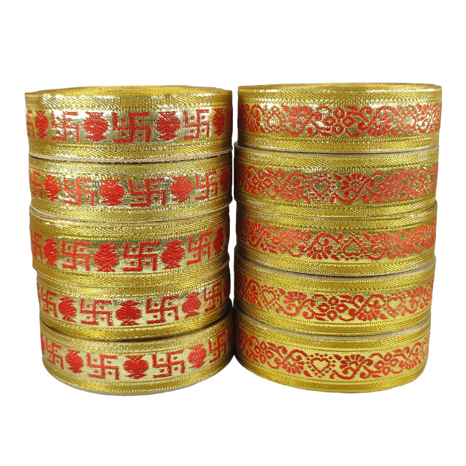 Stacks of gold bangles with red patterns on a white background